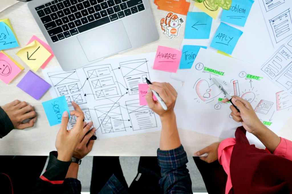 person writing on white paper