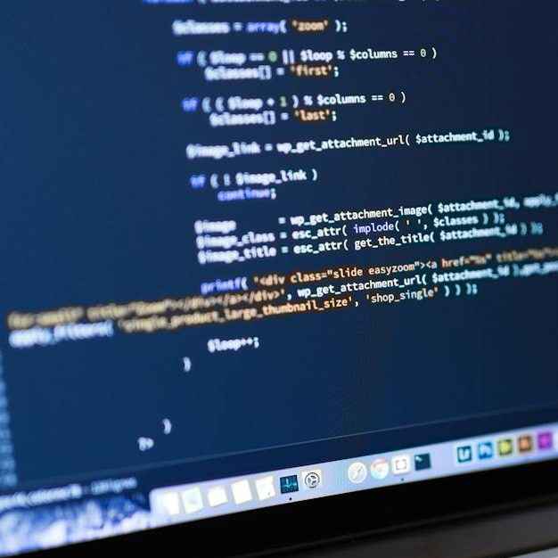 Focused view of programming code displayed on a laptop, ideal for tech and coding themes.