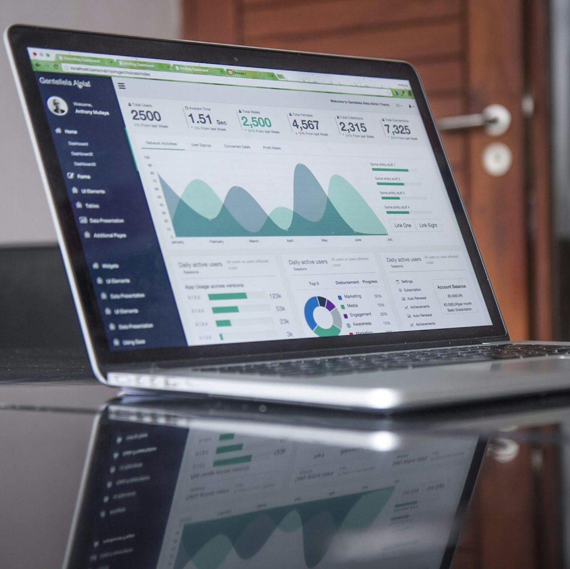 laptop computer on glass-top table