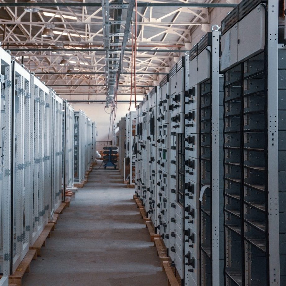 brown wooden hallway with gray metal doors